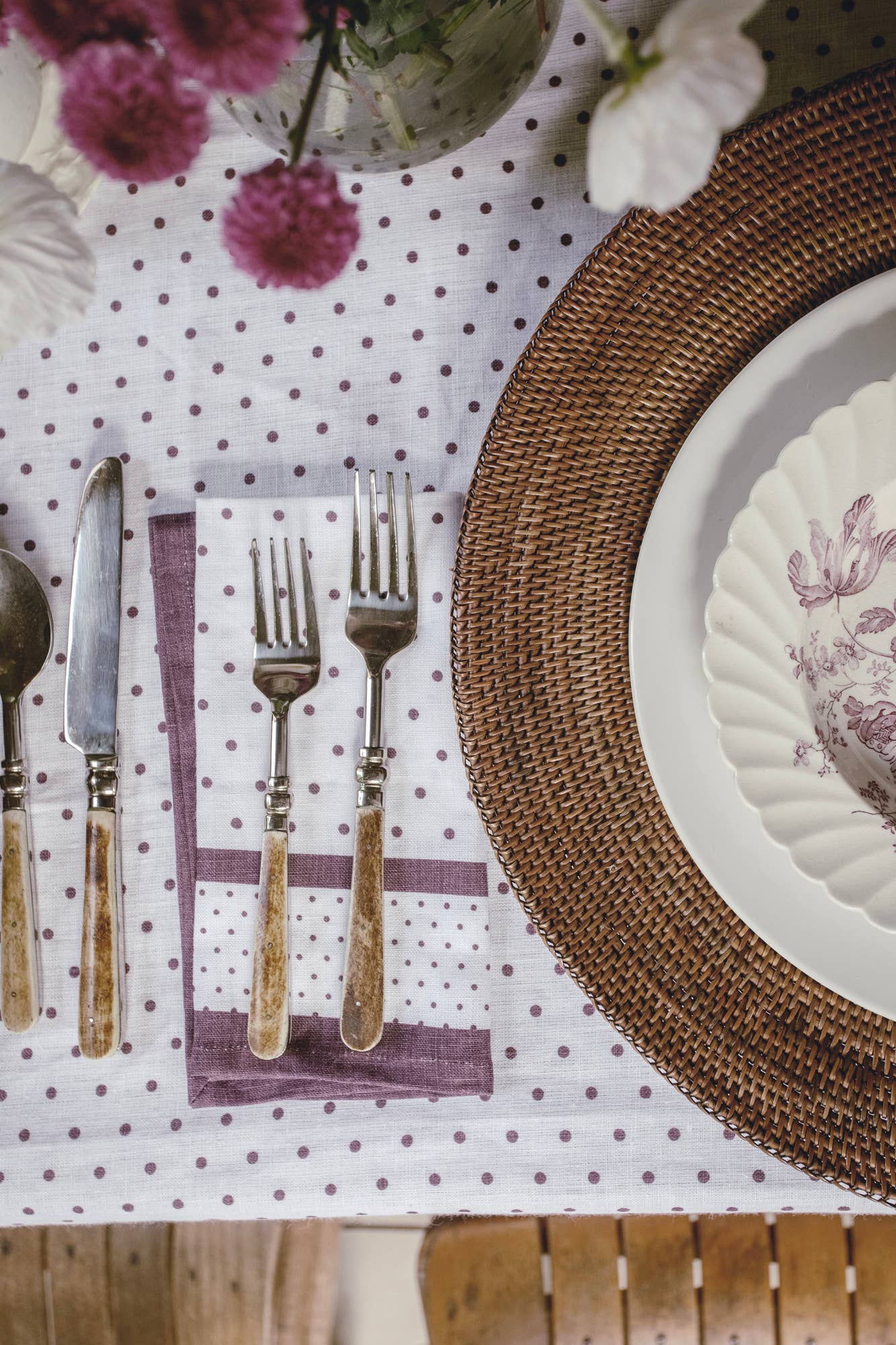 Elegant table styled with aubergine cloth napkin
