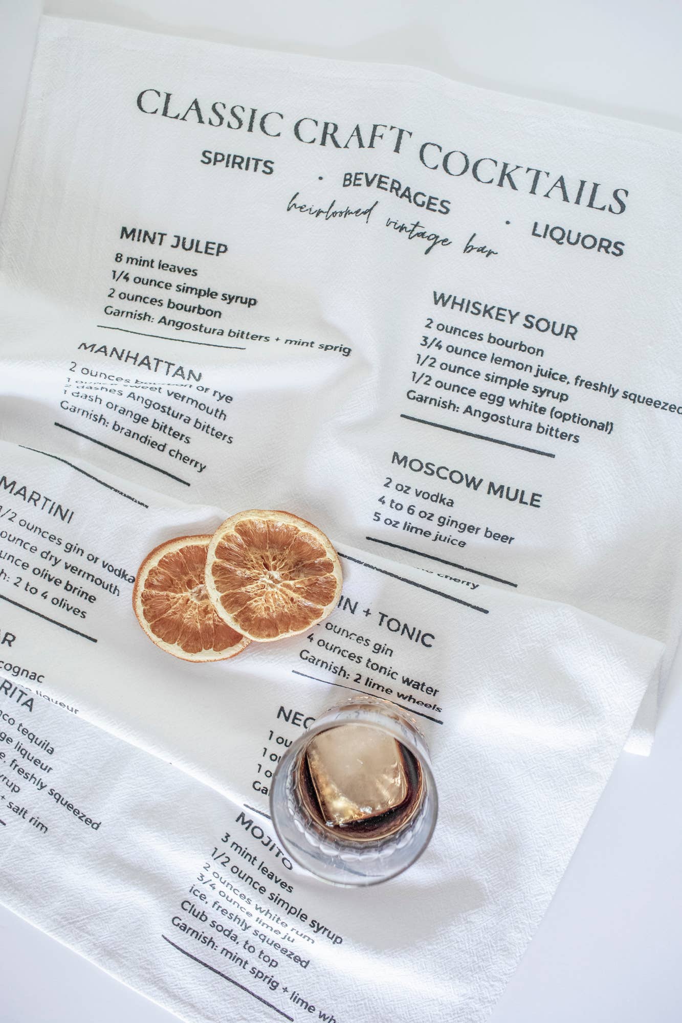Cotton tea towel printed with classic cocktail recipes
