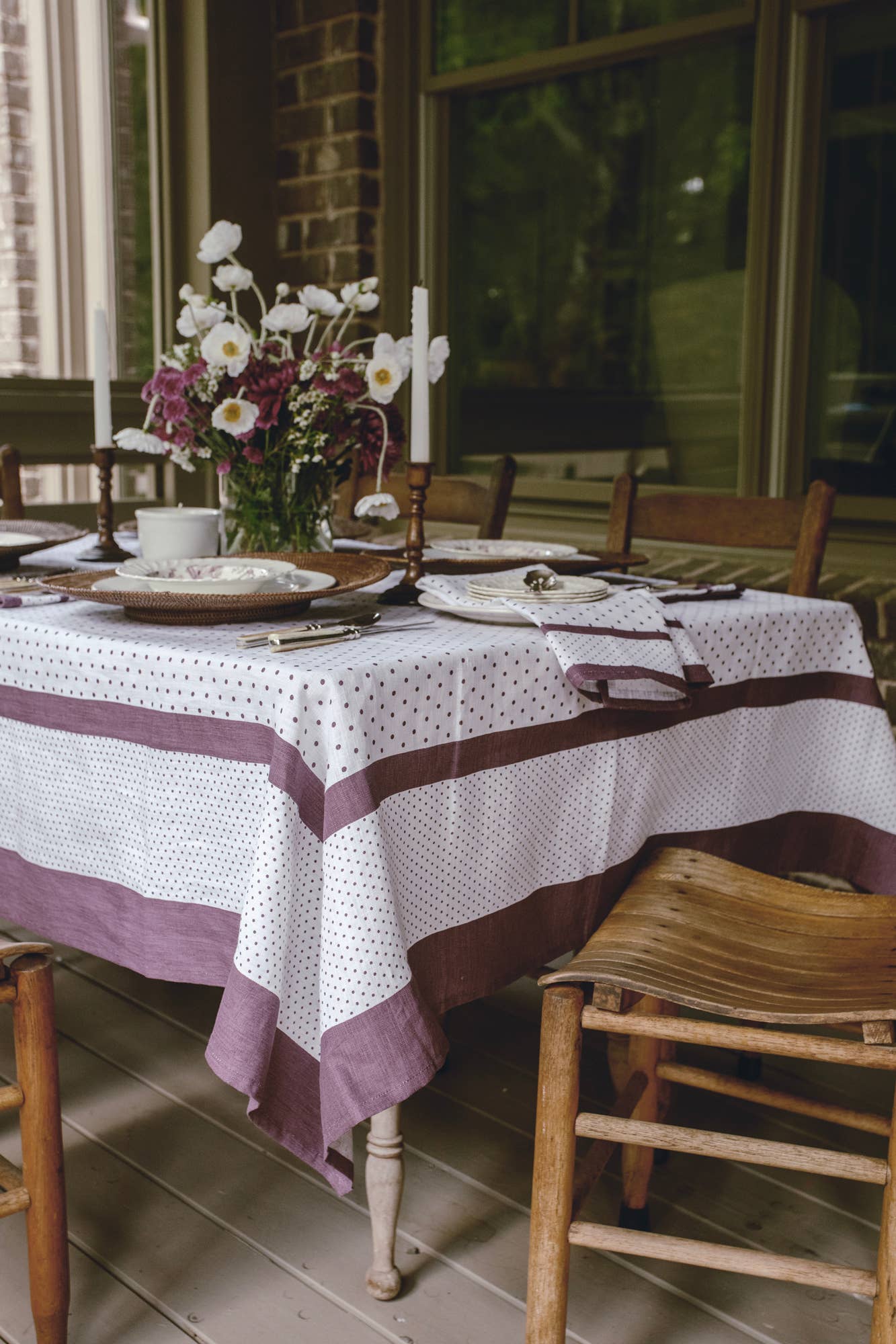 Aubergine linen tablecloth with British Dot pattern on dining table