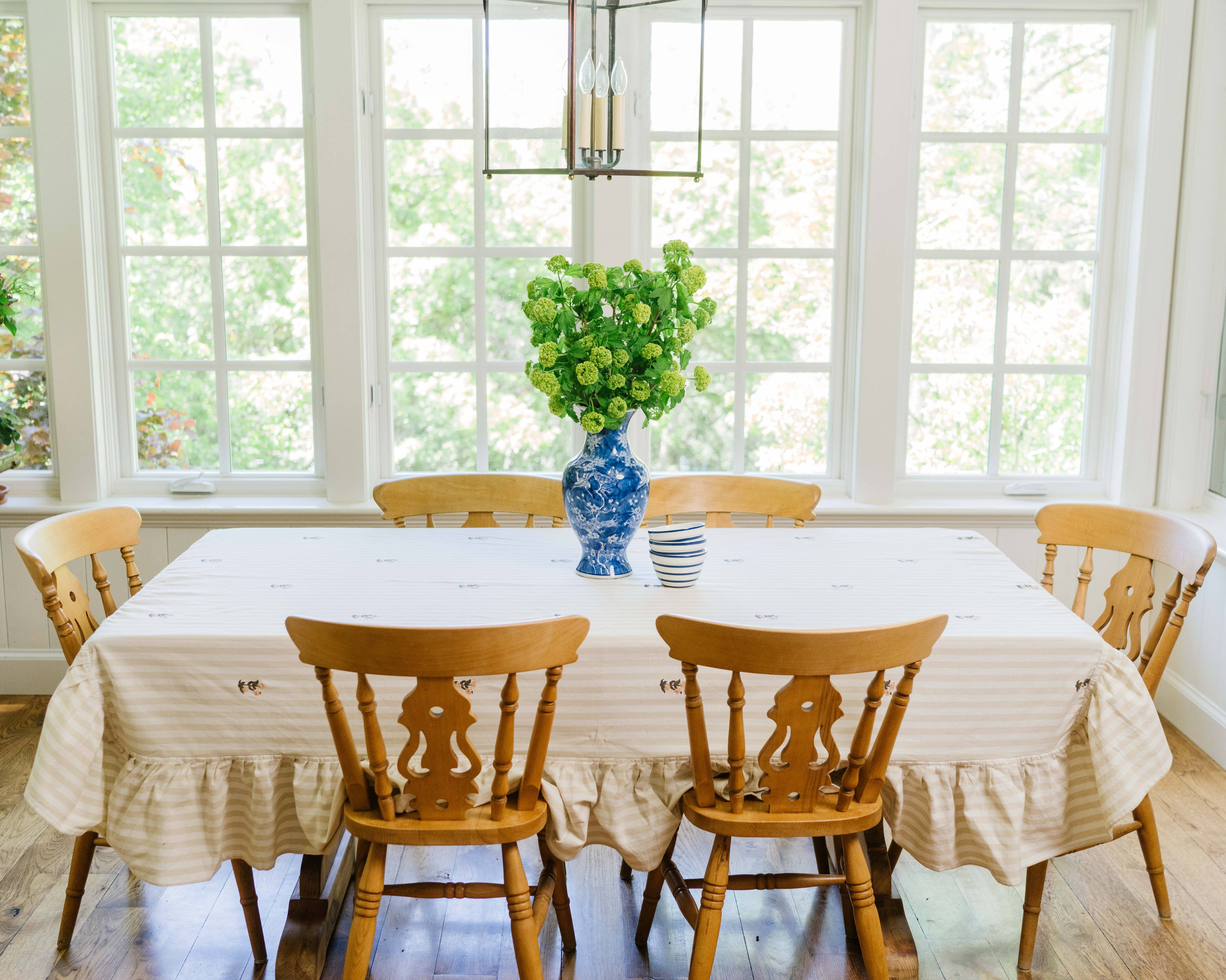 Beige and cream striped cotton tablecloth with ruffled edge and embroidered flowers