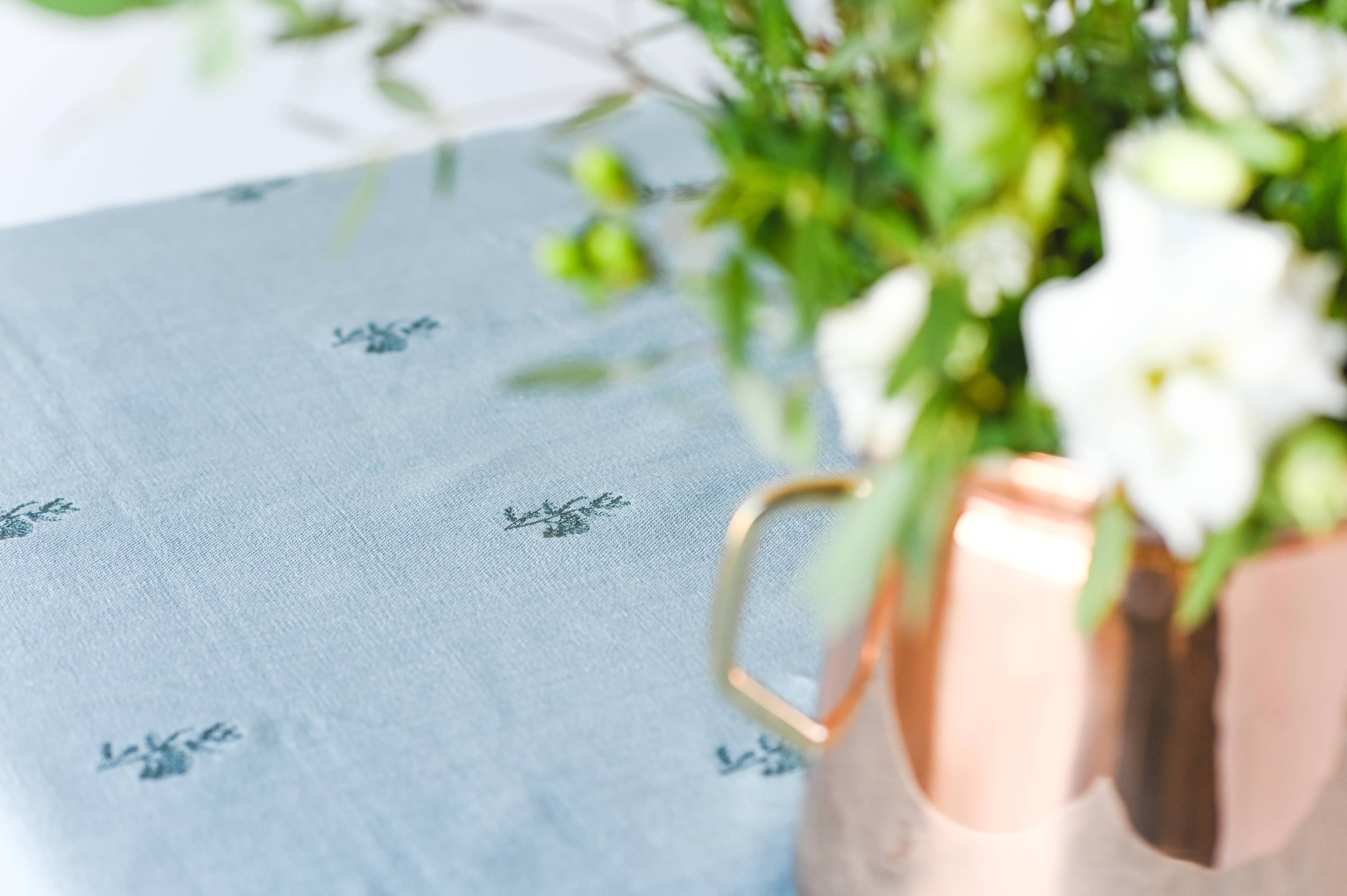 Heirloom-style tablecloth with delicate fleur embroidery