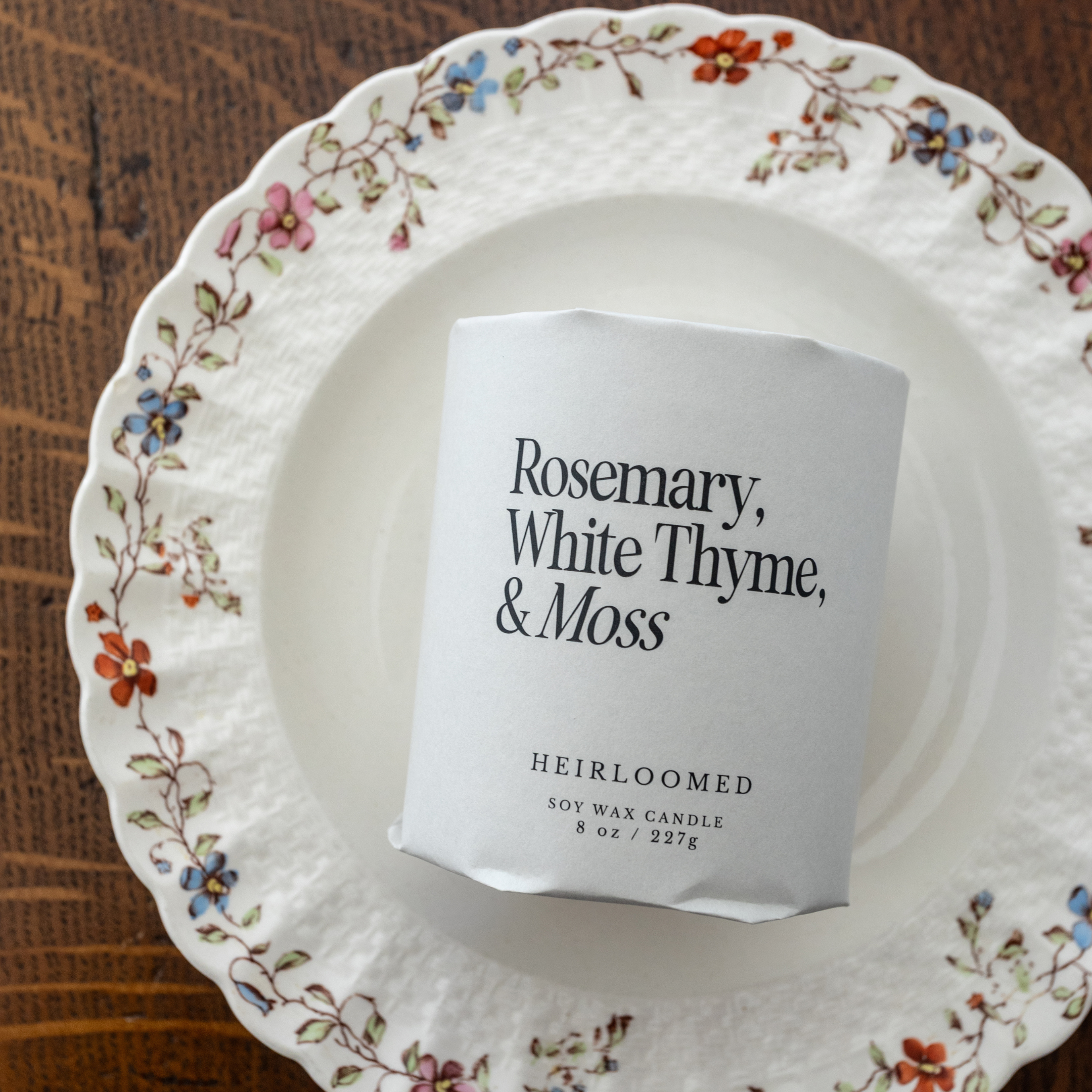 Hand-poured soy candle with rosemary, thyme, and moss scent