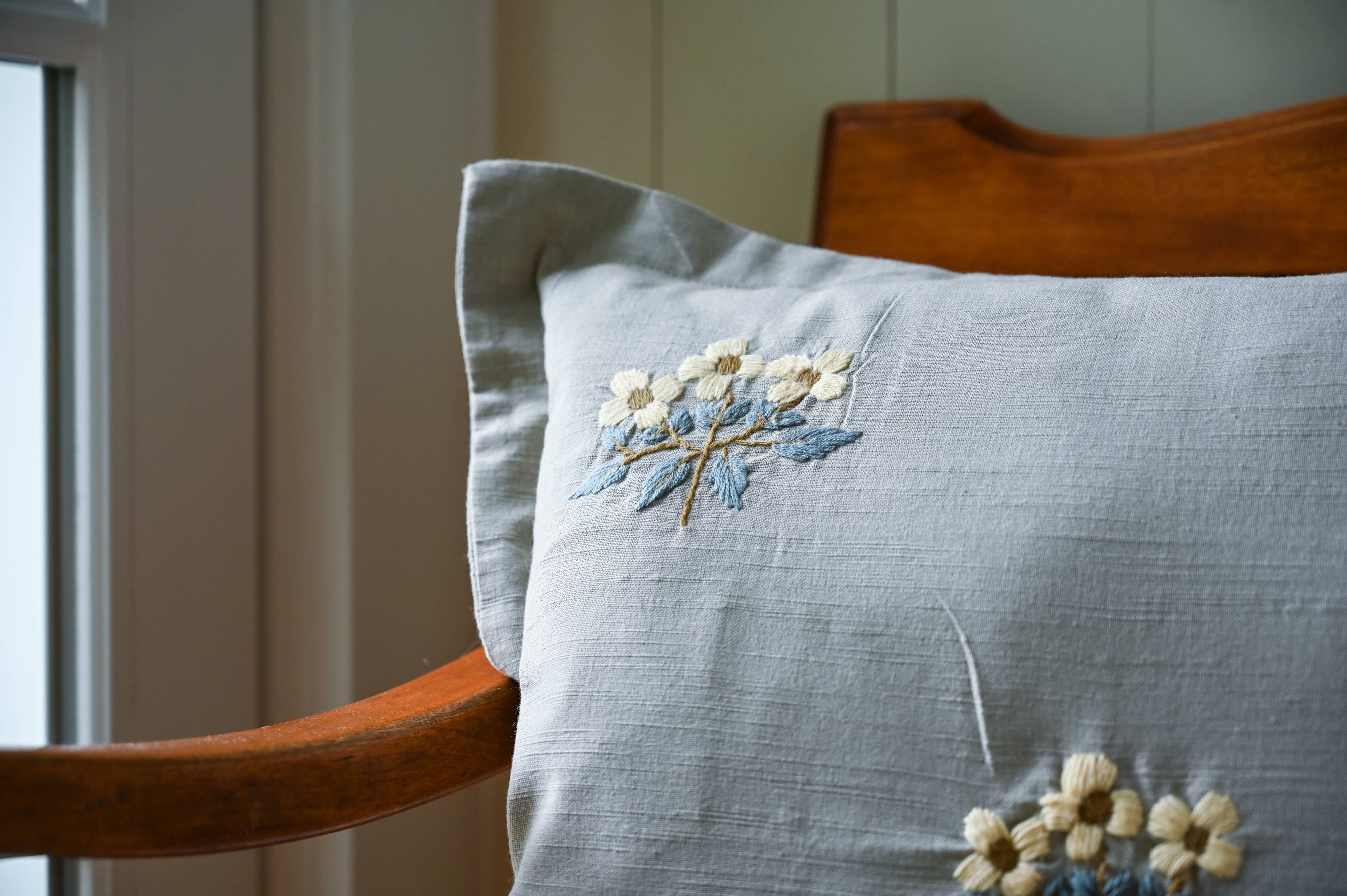 Heirloom-inspired embroidered pillow cover for cozy home styling