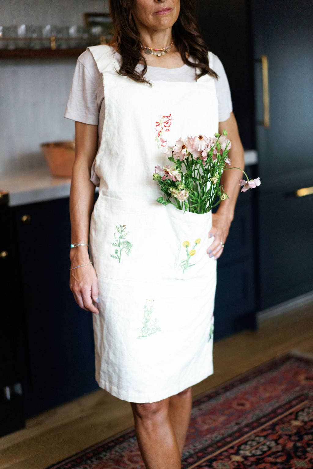 Cozy kitchen scene with botanical cotton apron