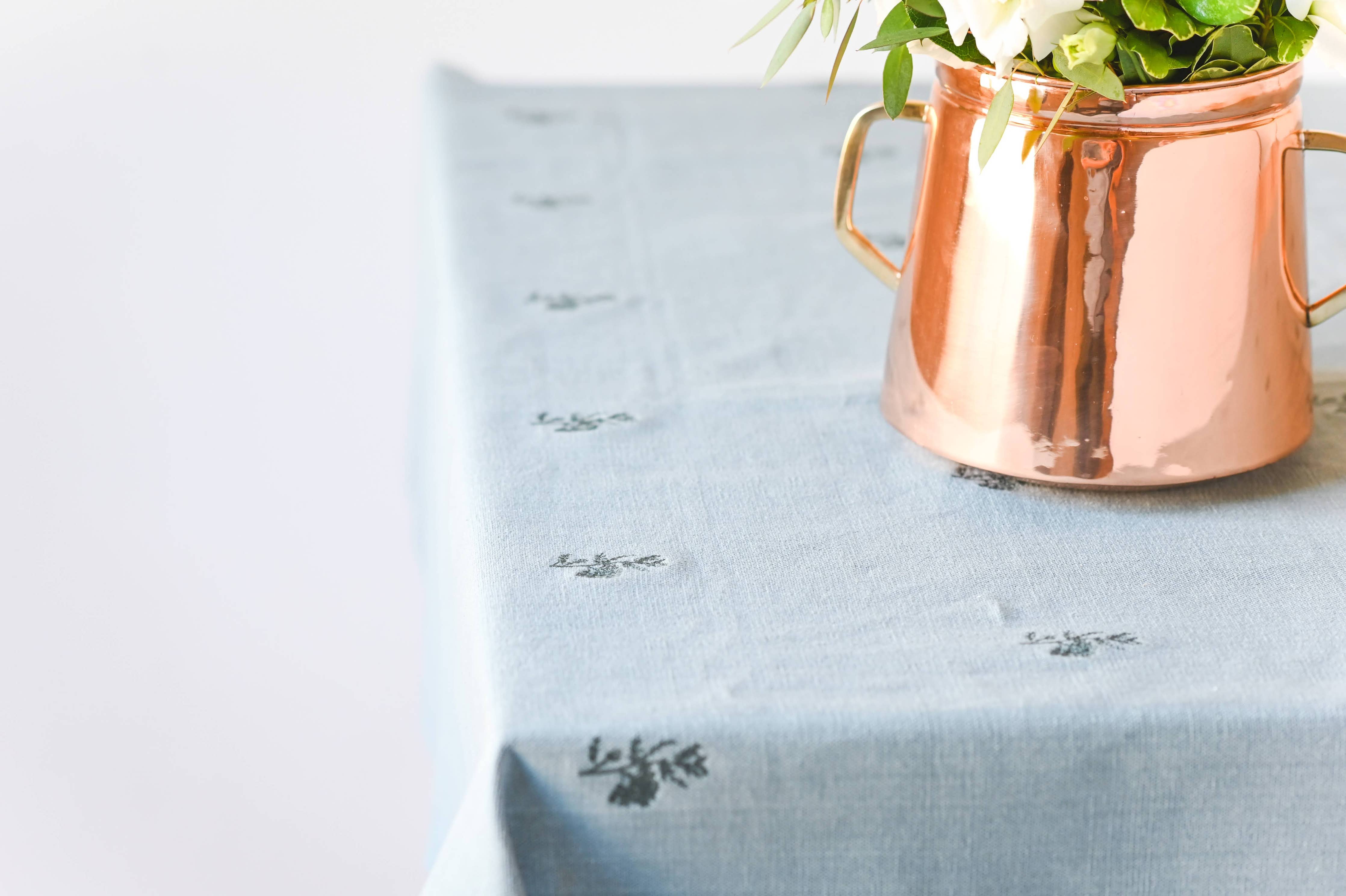 Vintage-inspired linen tablecloth in weathered blue-green tone