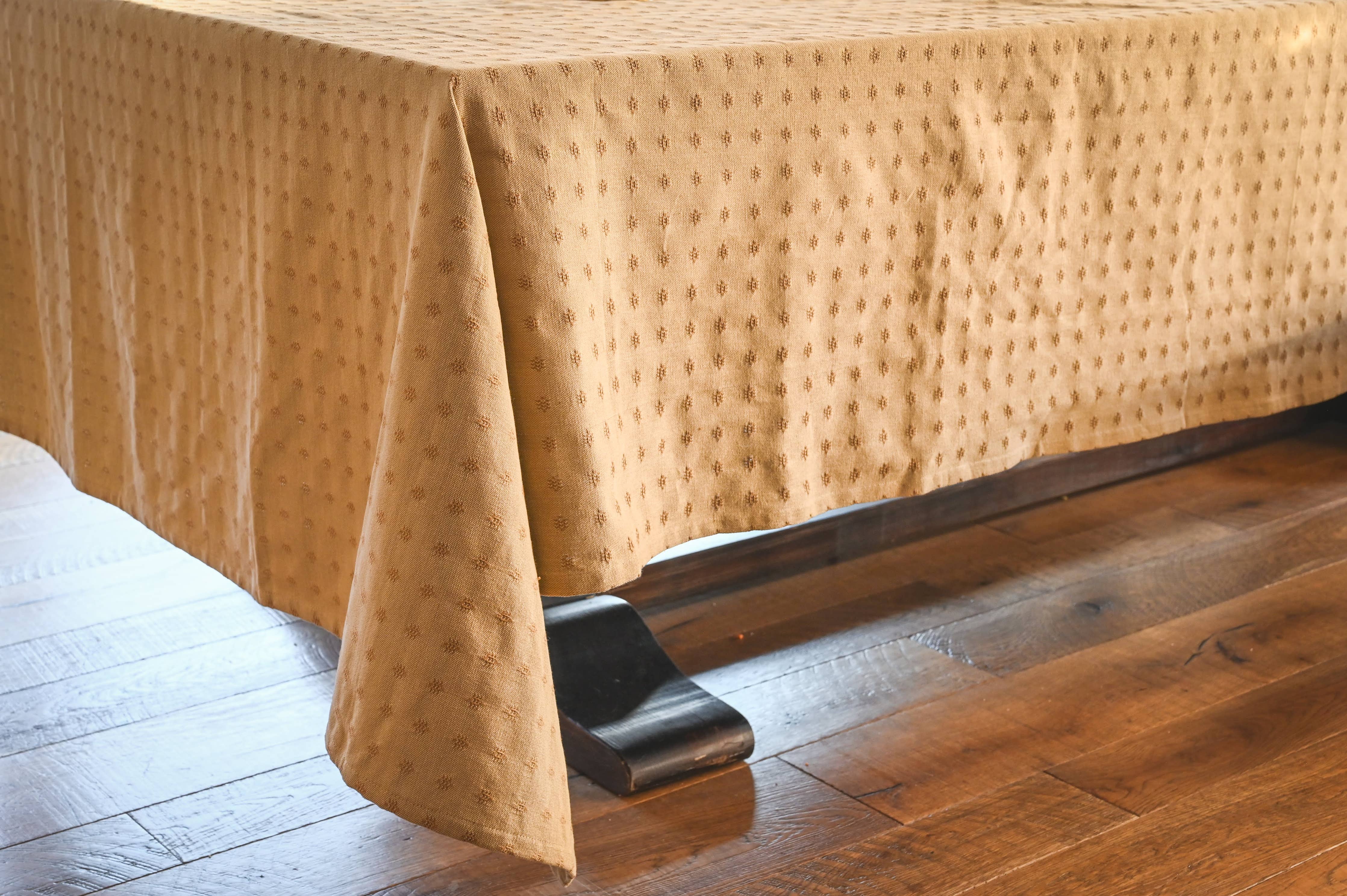 European-inspired linen tablecloth with woven dotted pattern