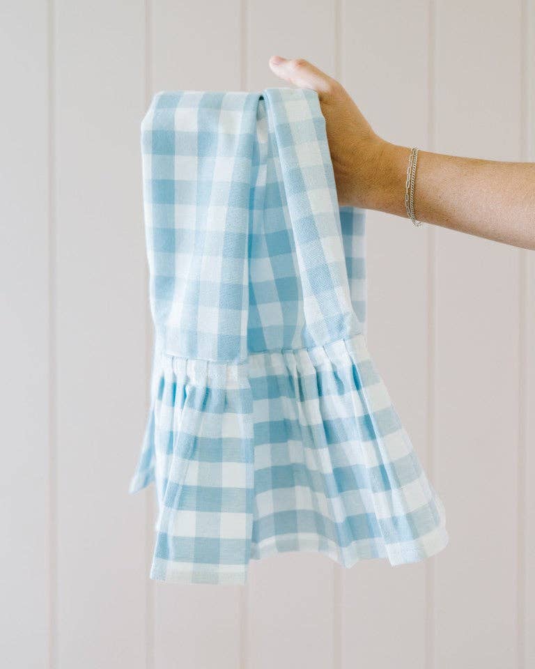 Gingham cotton dish towel with ruffle trim in kitchen setting